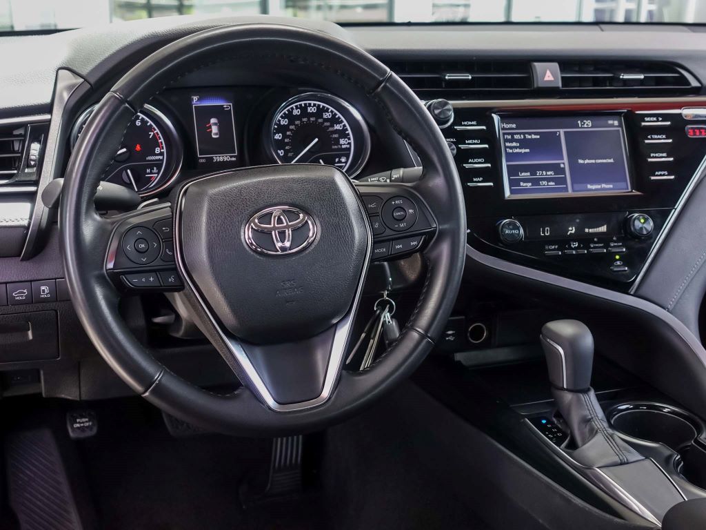 Toyota steering wheel and dashboard.