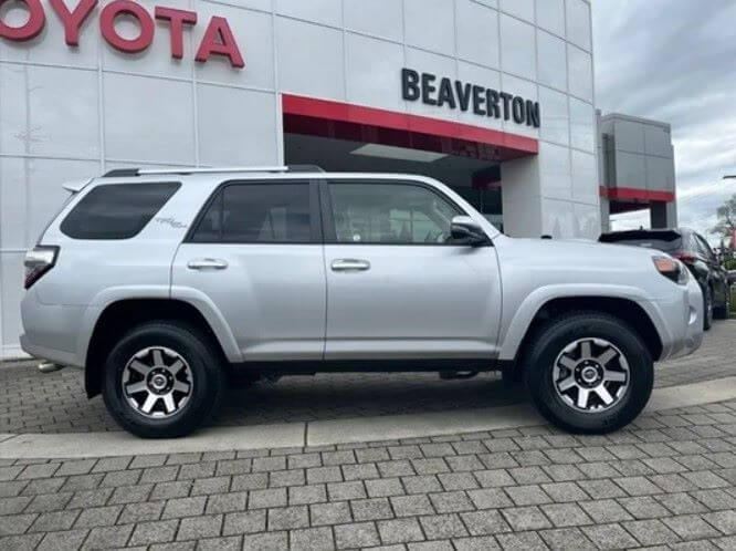 Silver Toyota 4Runner in front of Beaverton Toyota building.