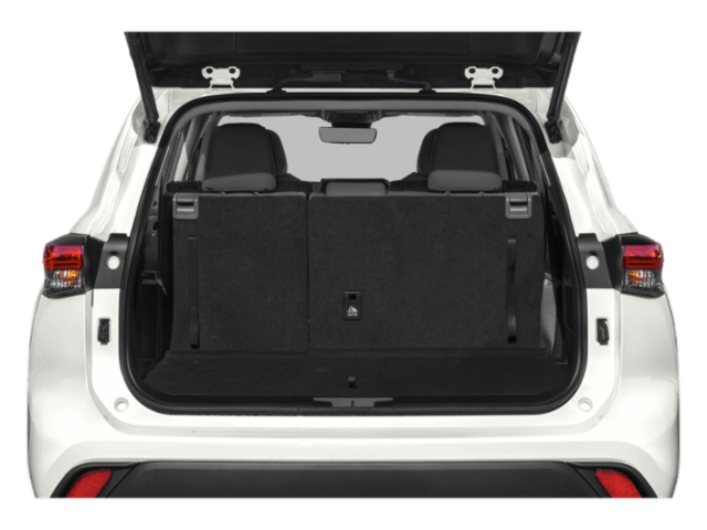 Rear view of white Toyota Highland Hybrid cargo space with hatch open..